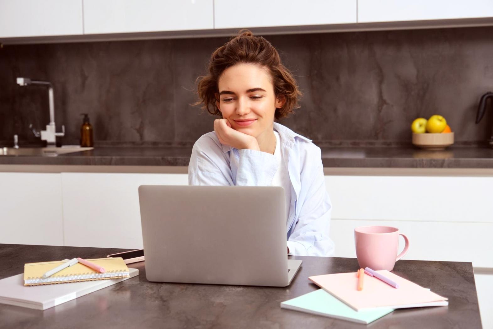 Financial planning workspace with budget documents and calculator showing detailed expense tracking