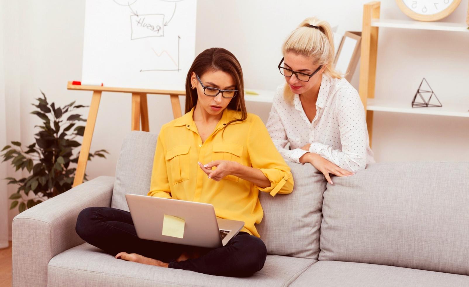 Business owner reviewing financial reports with advisor